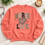 Coral unisex Nurse Life sweatshirt with leopard print lettering, heartbeat heart and stethoscope design