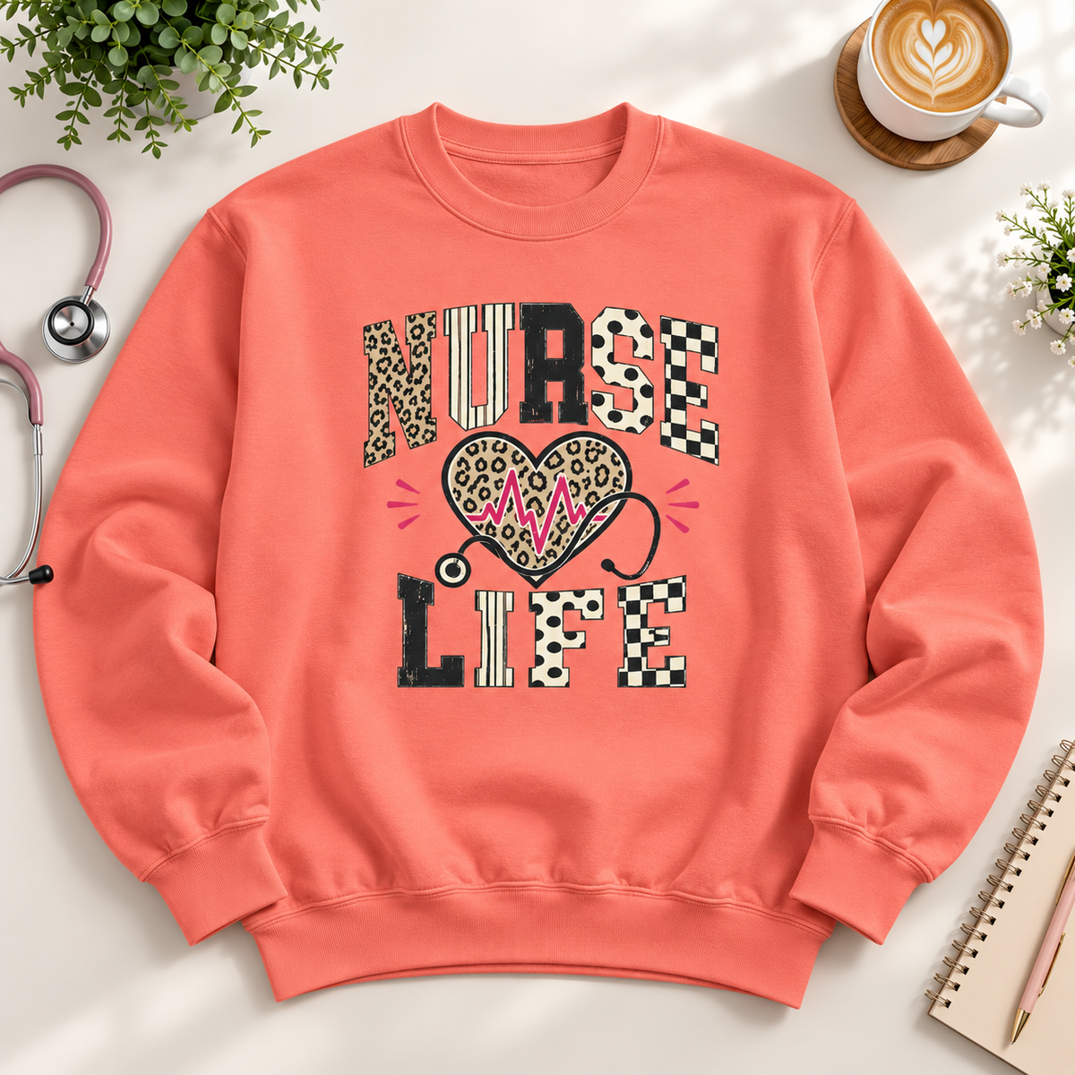 Coral unisex Nurse Life sweatshirt with leopard print lettering, heartbeat heart and stethoscope design